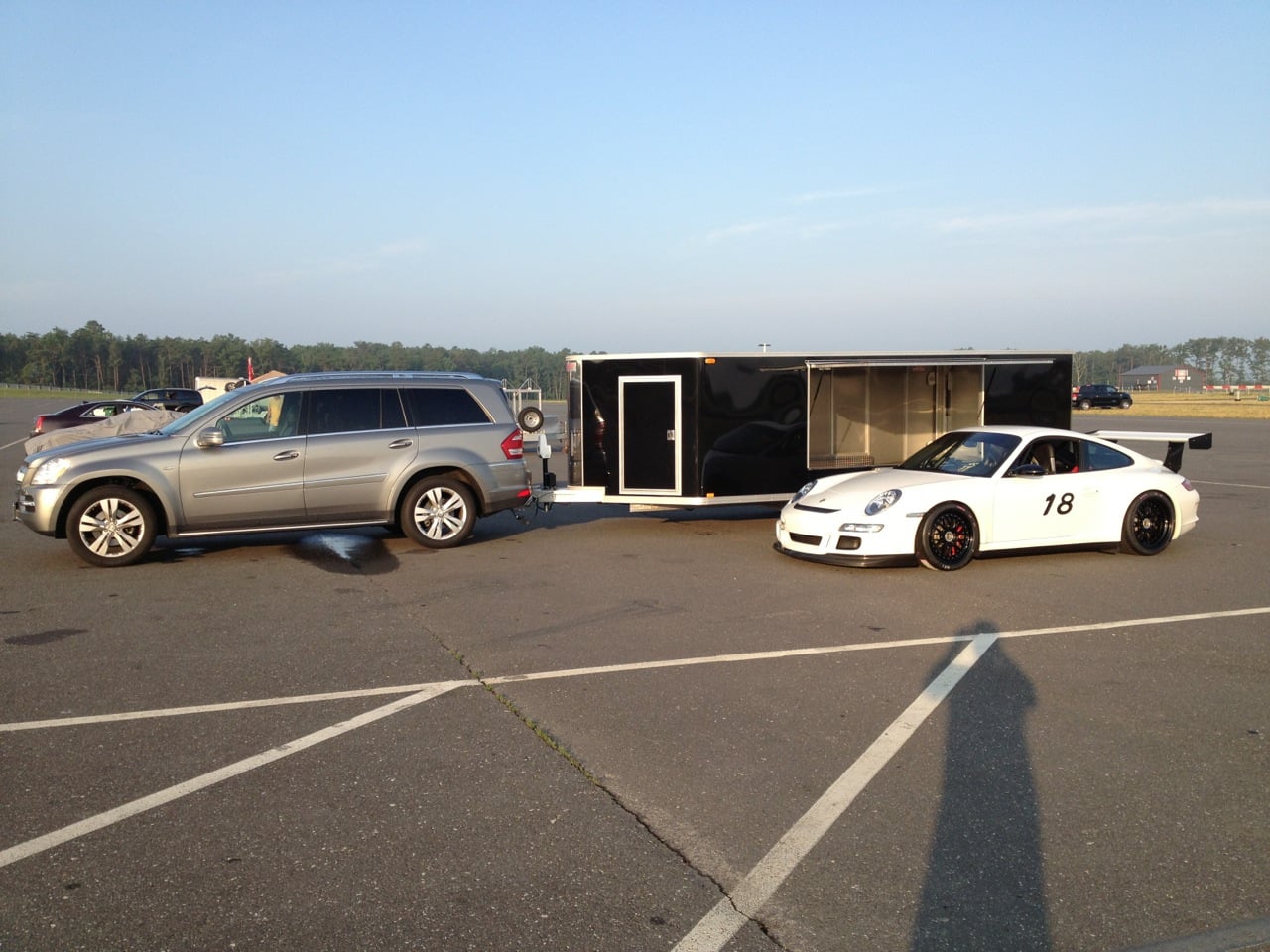 Porsche GT3 loaded on black enclosed trailer